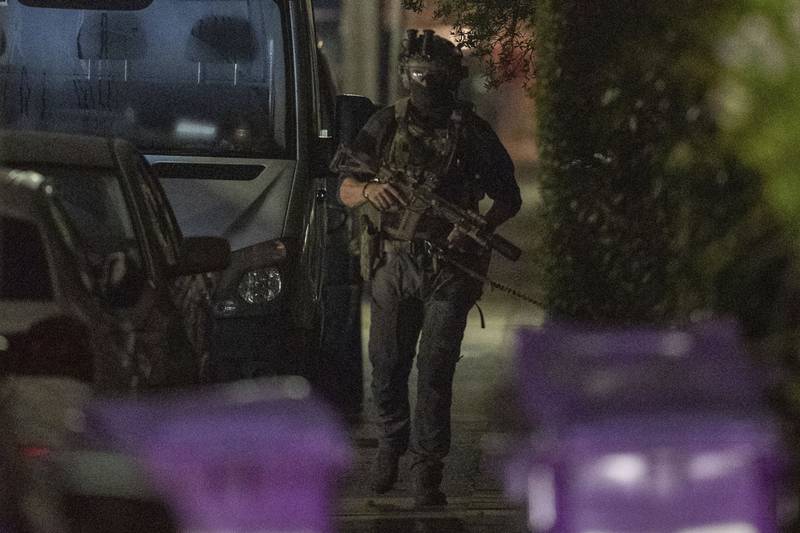 An armed police officer at Rutland Avenue in the Sefton Park area of the city. AP Photo