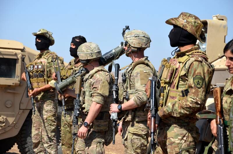 US soldiers and Syrian Democratic Forces (SDF) take part in military exercises close to the tri-border between Syria, Iraq, and Turkey in Al Hasakah governorate in north-eastern Syria. EPA