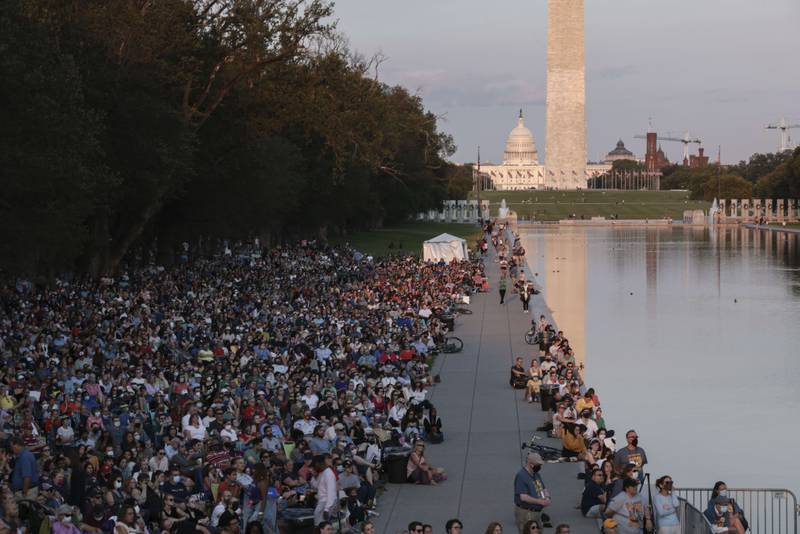 People watch the cast of the Broadway musical ‘Come From Away' perform a free concert in front of the Lincoln Memorial  in Washington. AFP