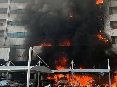 A number of apartments and cars were damaged in the blaze. Photo: Ajman Police