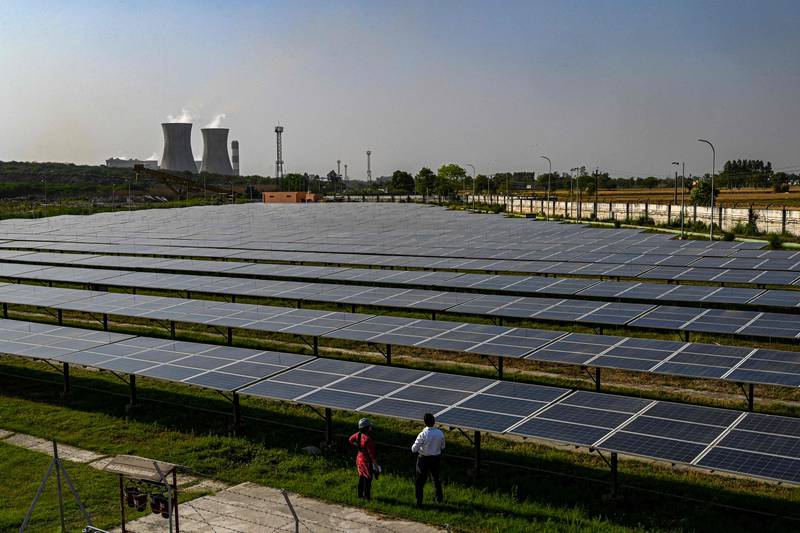 Solar panels are seen at the National Thermal Power Corporation plant, which is primarily coal-fired, in Dadri. India needs to increase its renewable power capacity to produce green hydrogen. AFP