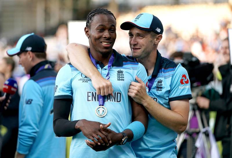 Jofra Archer, left, and Chris Woakes after England's triumph over New Zealand in the World Cup final at Lord's in July 2019. PA