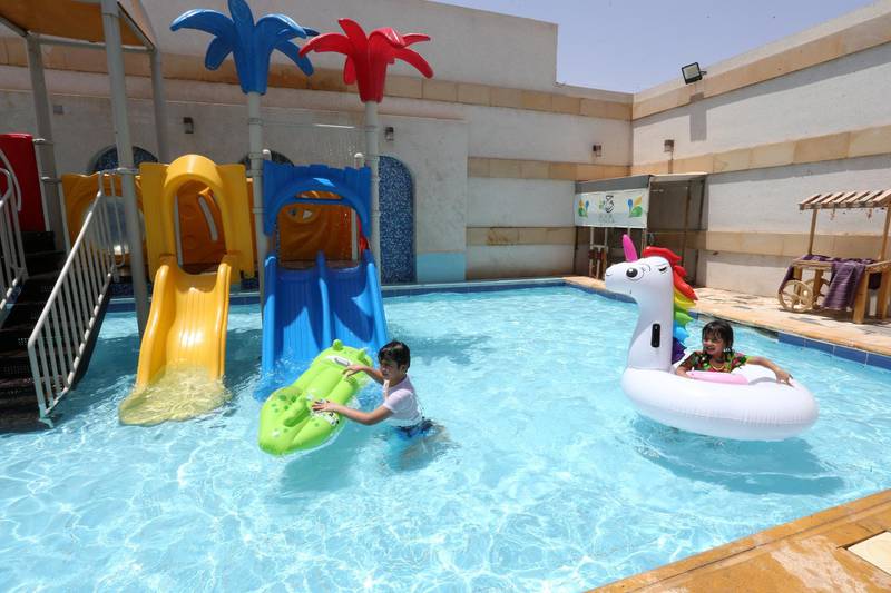 Children play in a rented chalet pool, after the government lifted the coronavirus restrictions, in Riyadh, Saudi Arabia. Reuters