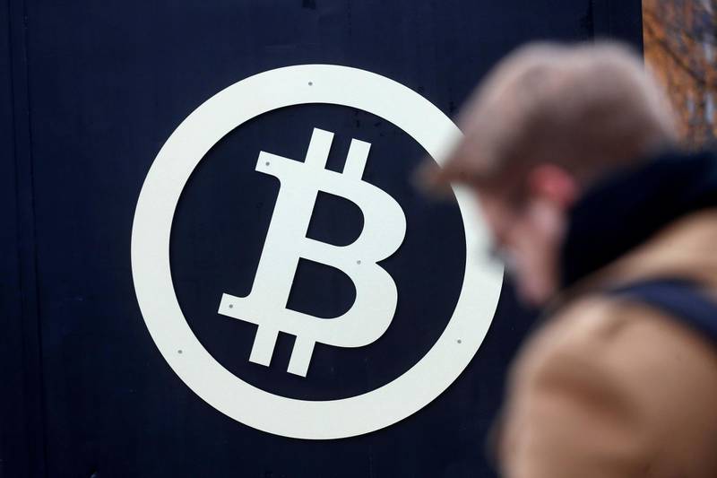 A bitcoin sign is seen during Riga Comm 2017, a business technology and innovation fair in Riga, Latvia November 9, 2017. REUTERS/Ints Kalnins - RC184DC8B2E0