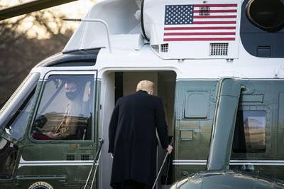 U.S. President Donald Trump boards Marine One on the South Lawn of the White House in Washington, D.C., U.S., on Wednesday, Jan. 20, 2021. Trump departs Washington with Americans more politically divided and more likely to be out of work than when he arrived, while awaiting trial for his second impeachment - an ignominious end to one of the most turbulent presidencies in American history. Photographer: Al Drago/Bloomberg