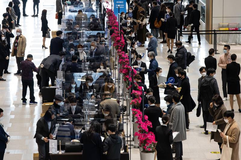 Event staff register attendees arriving for the Samsung Electronics Co. annual general meeting at the Suwon Convention Center in Suwon, South Korea. Bloomberg