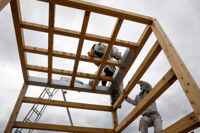 Workers dismantle a structure in preparation for Typhoon Hagibis in Toyota. EPA