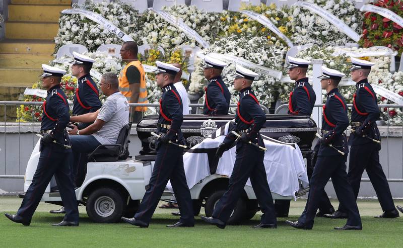 The casket of the late Pele is moved from the Urbano Caldeira Stadium, where his supporters paid their last respects. Reuters