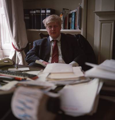 Mr Johnson at his desk in 2000 while he was a journalist for 'The Telegraph'. Getty Images