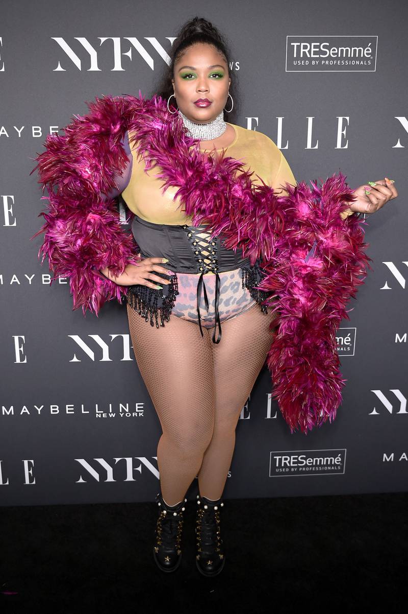 Lizzo in a bodice and fucshia-coloured feather boa on September 5, 2018. AFP