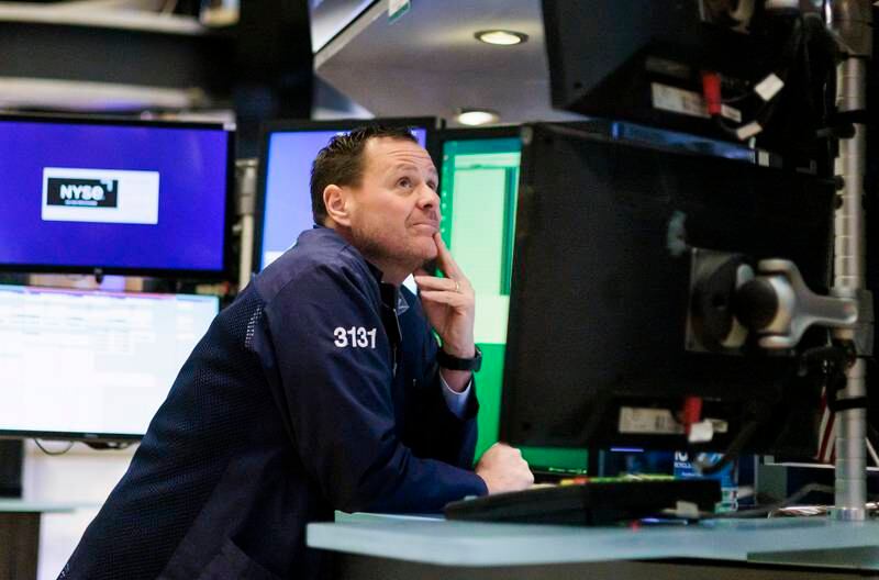 A trader works on the floor of the New York Stock Exchange. Steady improvements in gauges of market momentum and sentiment in recent weeks reinforced the view among some investors that asset prices may be heading for a more benign period. EPA
