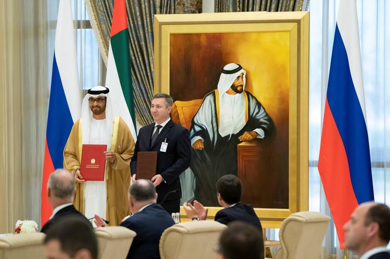 ABU DHABI, UNITED ARAB EMIRATES - October 15, 2019: HE Dr Sultan Ahmed Al Jaber, UAE Minister of State, Chairman of Masdar and CEO of ADNOC Group (L) exchanges an MOU with a Russian counterpart (R), during a state visit reception, at Qasr Al Watan. 

( Hamad Al Mansoori for the Ministry of Presidential Affairs )
---