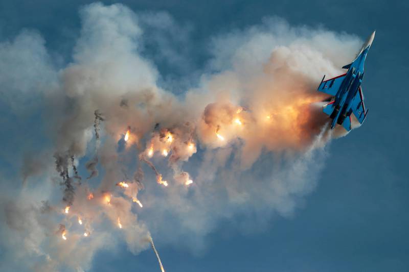 A Sukhoi Su-30SM fighter jet of the Russian Knights aerobatic team performs a stunt at an airbase outside Moscow. Andrey Volkov / Reuters