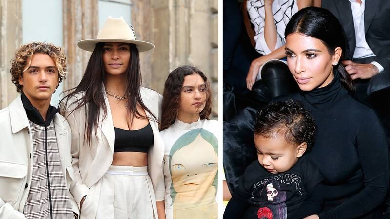 Left, Camila Alves McConaughey took her son Levi and daughter Vida to Paris Fashion Week; right, Kim Kardashian attended the Balenciaga spring/summer 2015 show with her then 15-month-old daughter, North. Getty Images