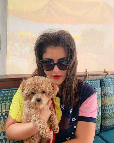 Here is tennis player Bianca Andreescu with the lovely Coco.