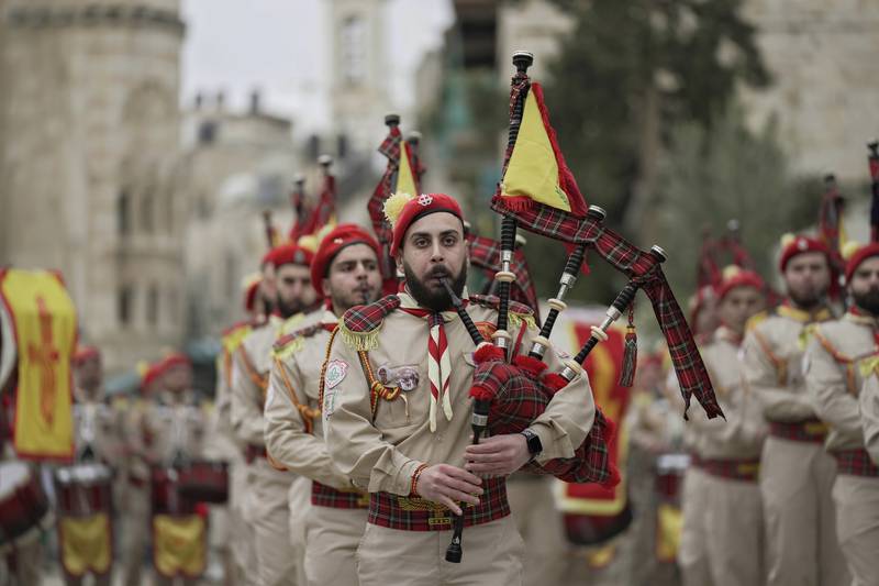 Palestinian scout pipe band members parade through Manger Square at the Church of the Nativity in Bethlehem, in the occupied West Bank, on Christmas Eve. AP Photo