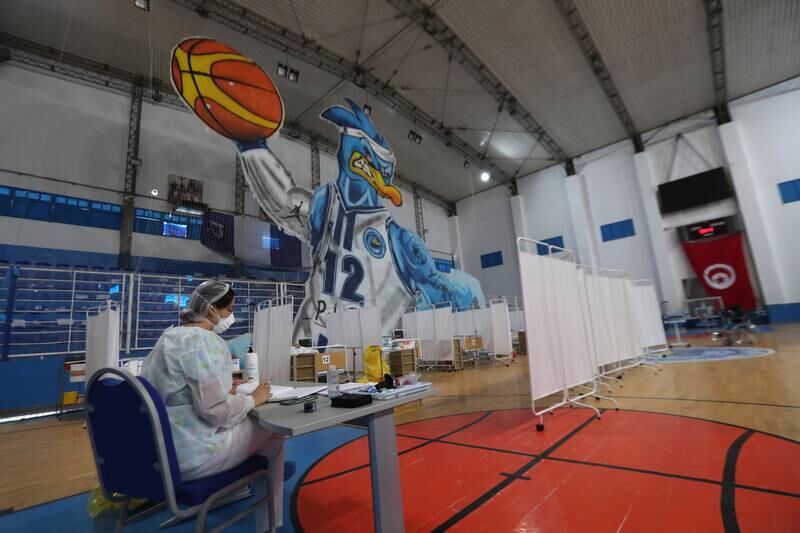 A nurse works in a basketball hall that was converted into makeshift hospital to deal with a surge in Covid-19 infections in Tunis. EPA