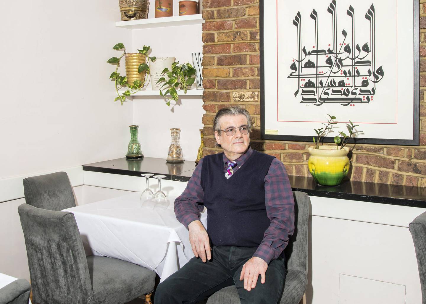 Mohammad Antabli, General Manager of Alwaha Restaurant in Westbourne Grove London. Photographed for TheNational. Calligraphy by Mouneer Al-Shaarani