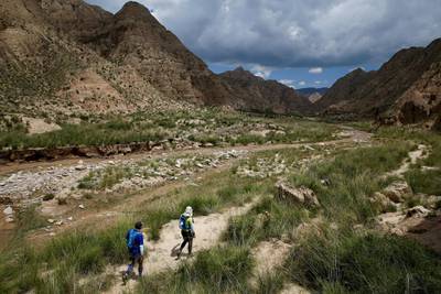 Participants compete during the Super Salmon ultra-marathon near the Longyangxia Reservoir in Gonghe County, Qinghai province, China, August 11, 2018.  Picture taken August 11, 2018.  REUTERS/Thomas Peter