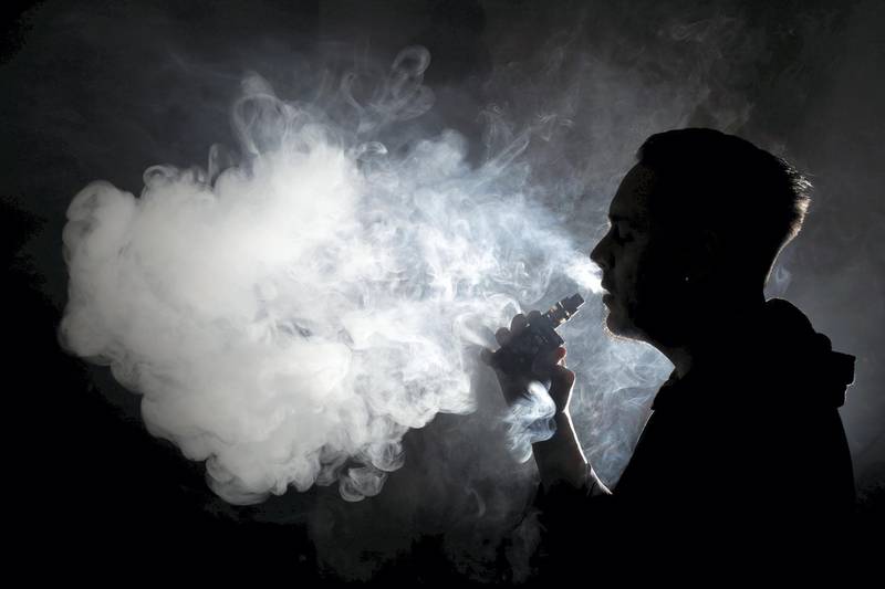A man poses for a picture, as he vapes at home in Ciudad Juarez, Mexico January 28, 2019. Picture taken January 28, 2019. REUTERS/Jose Luis Gonzalez