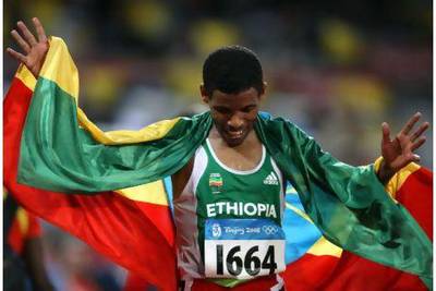 Ethiopia's Haile Gebrselassie celebrates after winning the men's 10,000m at the 2008 Beijing Olympic Games.