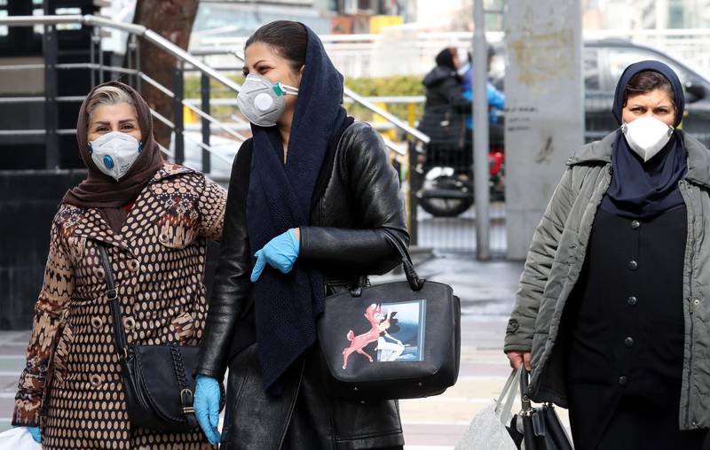 Iranian women wearing face masks walk on a street of Tehran, Iran. According to the Ministry of Health, 139 people diagnosed with the Covid-19.  EPA