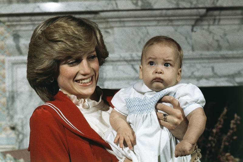 1982: A 6-month old Prince William with his mother Princess Diana at Kensington Palace in London. Prince William is celebrating his 40th birthday in 2022. Here 'The National' looks back at each of the years of his life. AP Photo