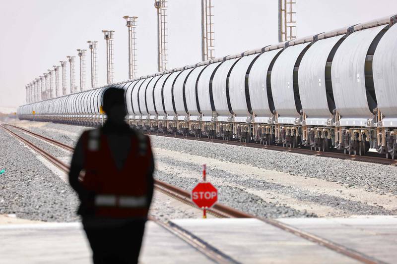 An Etihad Rail train at Al Mirfa. A fully loaded freight train can carry the equivalent cargo of 300 lorries – reducing carbon dioxide emission by up to 80 per cent. AFP