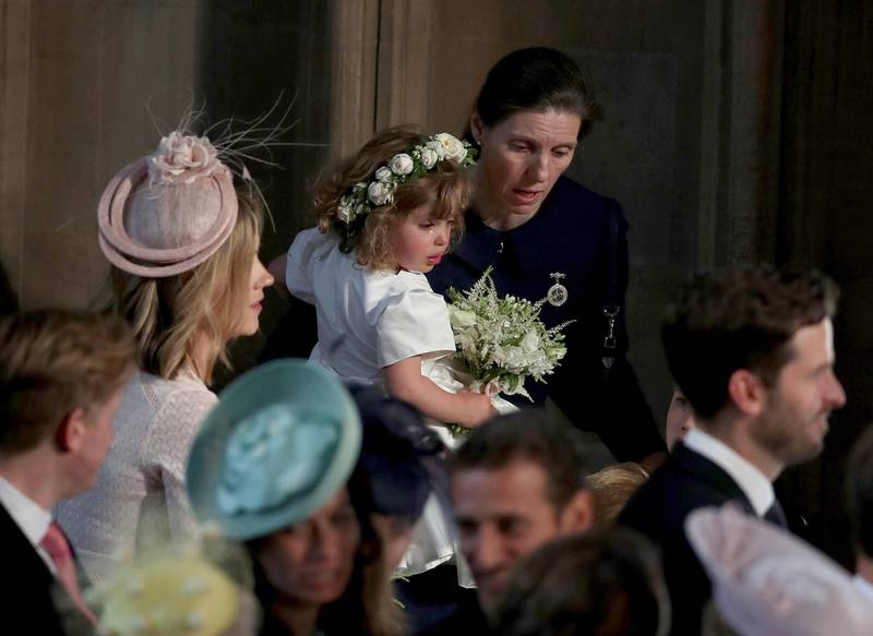 William and Kate's Spanish nanny Maria Borrallo helps to comfort crying bridesmaid Zalie Warren. AFP