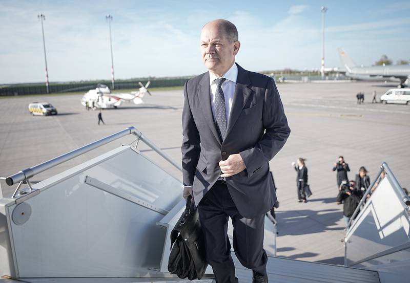 Olaf Scholz boarding a plane on his way to the Cop27 summit in Egypt on Monday. AP