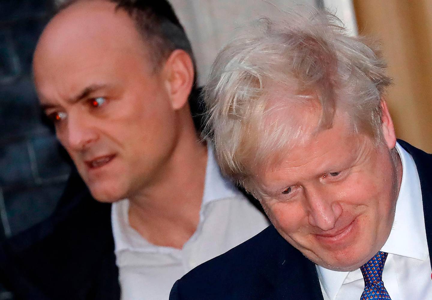 (FILES) In this file photo taken on October 28, 2019 Britain's Prime Minister Boris Johnson (R) and Number 10 special advisor Dominic Cummings leave from 10 Downing Street in central London. One of British Prime Minister Boris Johnson's top advisers, Dominic Cummings, drew police attention after allegedly breaking the coronavirus lockdown, reports said on May 22. Cummings left his London home to stay with his parents in Durham, northeast England, while suffering symptoms of COVID-19, the Daily Mirror and The Guardian newspapers said.
 / AFP / Tolga AKMEN
