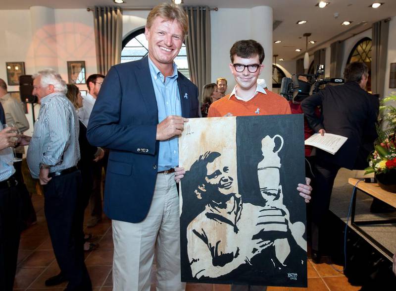 Ernie Els, left, and Alex Loveday of Mawaheb art studio. Victor Besa for The National