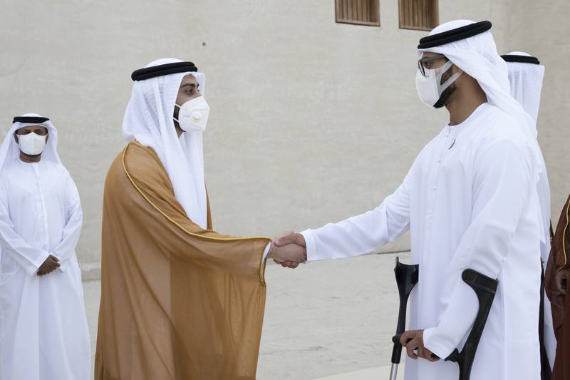 Sheikh Zayed bin Hamdan bin Zayed (R) greets Sheikh Zayed bin Mansour bin Zayed at the wedding.