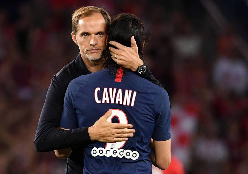 Paris Saint-Germain's German coach Thomas Tuchel (L) greets Paris Saint-Germain's Uruguayan forward Edinson Cavani at the end of the match.  AFP