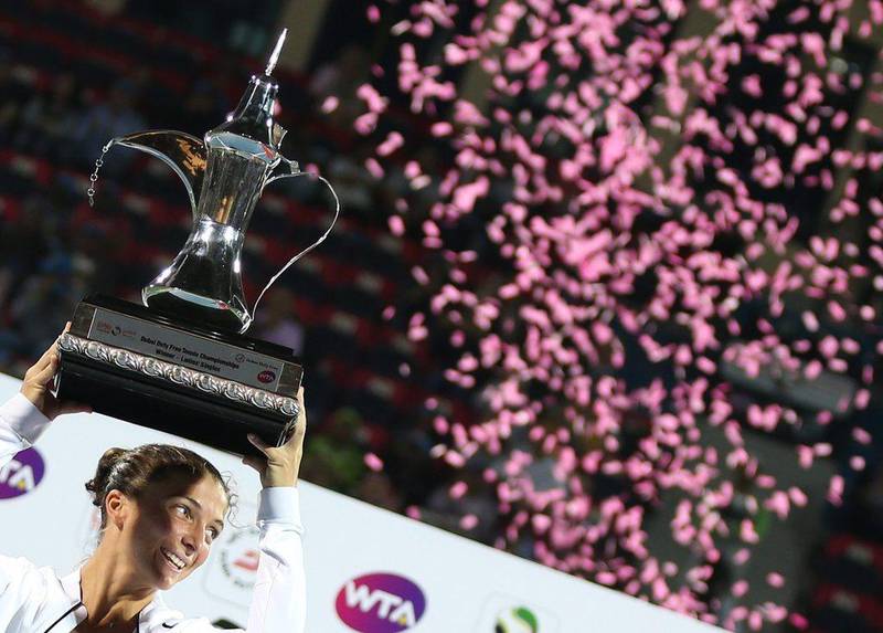 Sara Errani of Italy holds the trophy after winning the Dubai Duty Free Tennis Championships final against Barbora Strycova on Saturday. Ali Haider / EPA / February 20, 2016 