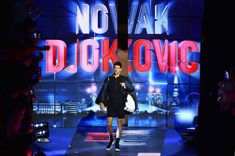TOPSHOT - Serbia's Novak Djokovic walks on court to play against Germany's Alexander Zverev during their mens singles round-robin match on day four of the ATP World Tour Finals tennis tournament at the O2 Arena in London on November 14, 2018.  / AFP / Glyn KIRK                  
