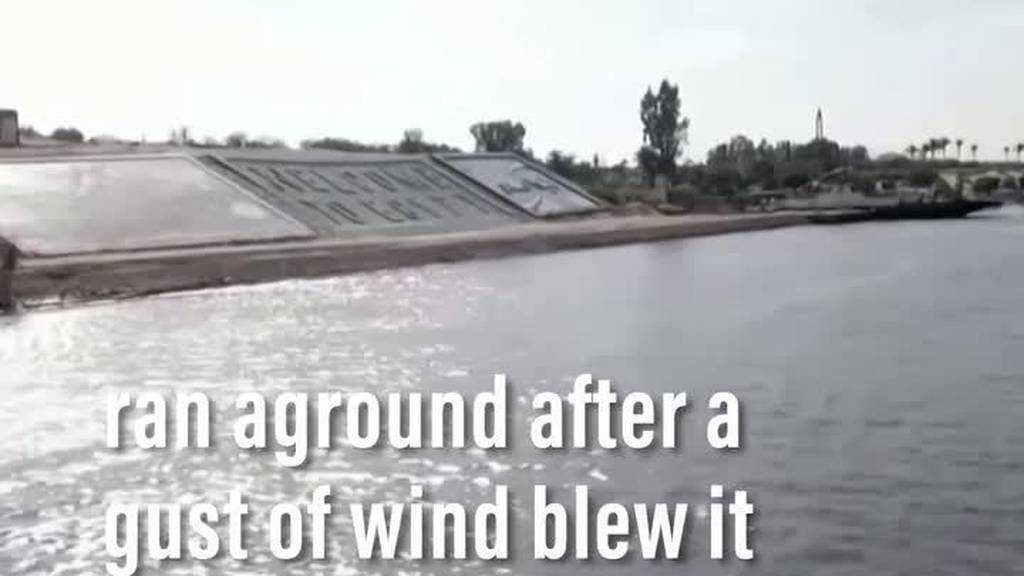 Suez Canal blocked as container ship runs aground