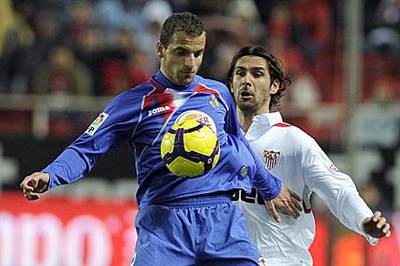 Roberto Soldado shields the ball from a Sevilla defender in a Copa del Rey match last month.