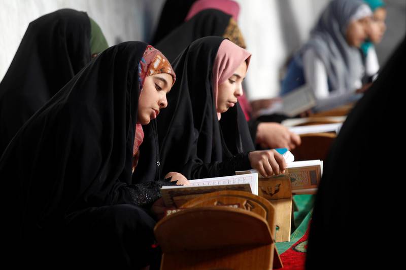 Women read the Quran at Al Qasim Mosque during the month of Ramadan in Hilla, Iraq. Reuters