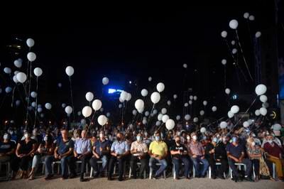 Supporters of Lebanon's Free Patriotic Movement release white balloons to mark one year since the huge explosion in Beirut's port. At least 200 people were killed, and more than 6,000 injured in the blast on August 4, 2020.