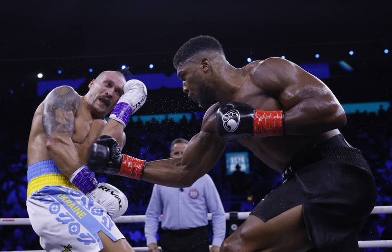 Anthony Joshua with a body shot. Action Images