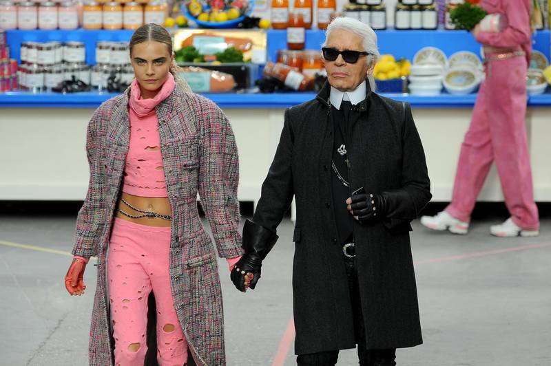 PARIS, FRANCE - MARCH 04:  Fashion Designer Karl Lagerfeld and model Cara Delevingne appear at the end of the runway during the Chanel show as part of the Paris Fashion Week Womenswear Fall/Winter 2014-2015 on March 4, 2014 in Paris, France.  (Photo by Francois Durand/Getty Images)