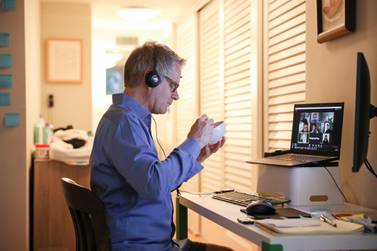 Doug Hassebroek eats breakfast while on a video conference call working from home in Brooklyn, New York City, on April 24. Caitlin Ochs / Reuters