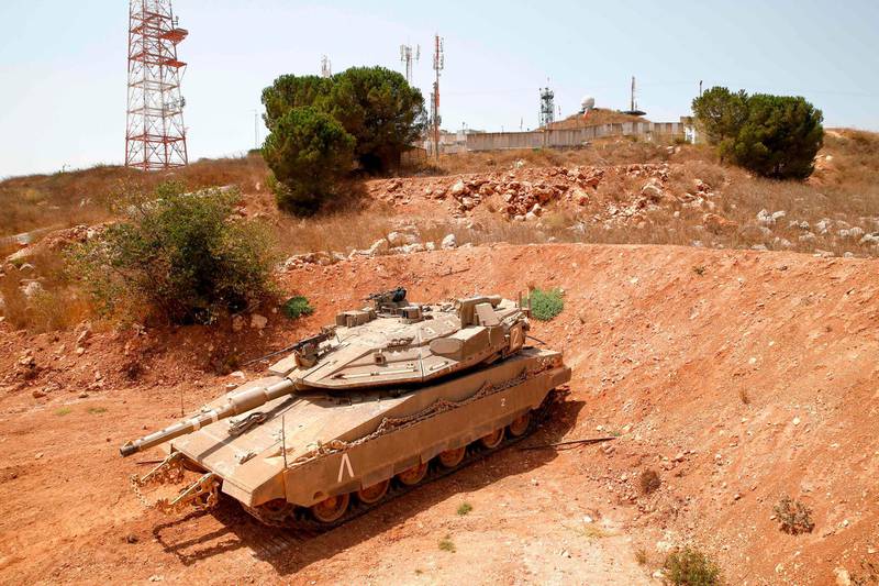 An Israeli Merkava tank is positioned along the border with neighbouring Lebanon on August 27, 2019.  Israeli Prime Minister Benjamin Netanyahu today warned Lebanon, Hezbollah's chief and the head of Iran's elite Quds Force to "be careful" with their words and actions.
Netanyahu spoke after a series of incidents in recent days that have raised tensions between Israel, Lebanon, Iran and Tehran-backed Hezbollah. / AFP / JACK GUEZ
