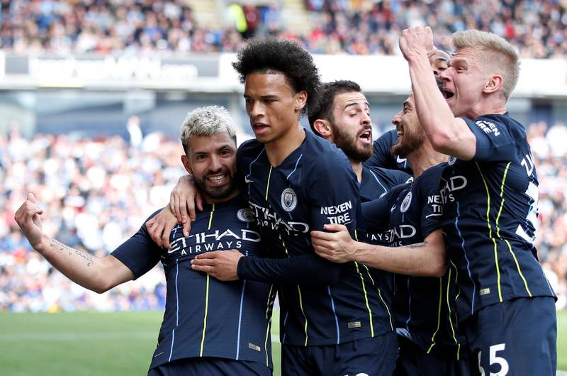 Manchester City's Sergio Aguero celebrates scoring their goal with Leroy Sane and teammates. Reuters