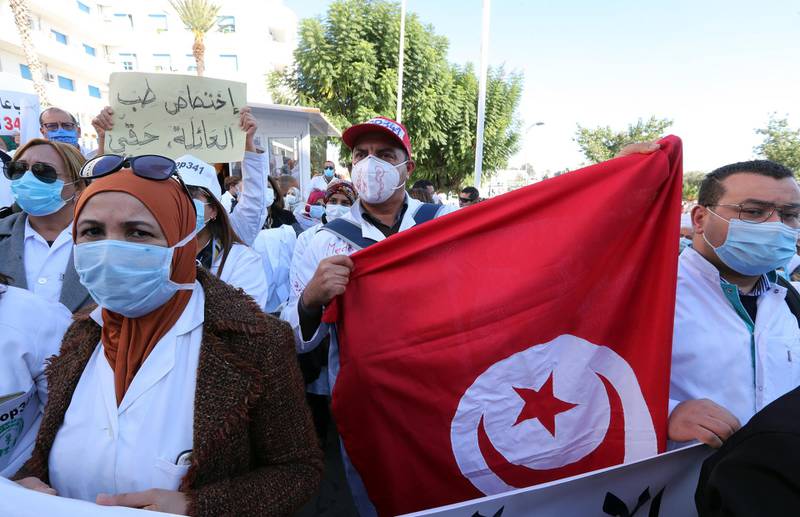 General health practitioners attend a protest against the application of article 341, which sets the framework of the studies and the conditions for obtaining medical diplomas, in front of the headquarters of the Ministry of Health in Tunis, Tunisia. EPA