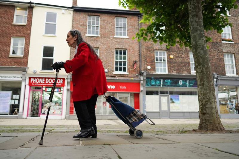 YORK, UNITED KINGDOM - JUNE 15: A woman walks through the centre of York as non-essential stores prepare to reopen on June 15, 2020 in York, United Kingdom. As the British government further relaxes Covid-19 lockdown measures in England, this week sees preparations being made to open non-essential stores, travellers will be required to wear face coverings on public transport and international travellers arriving in the UK will face a 14-day quarantine period. (Photo by Ian Forsyth/Getty Images)