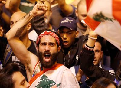Demonstrators shout during a protest in Tripoli. REUTERS