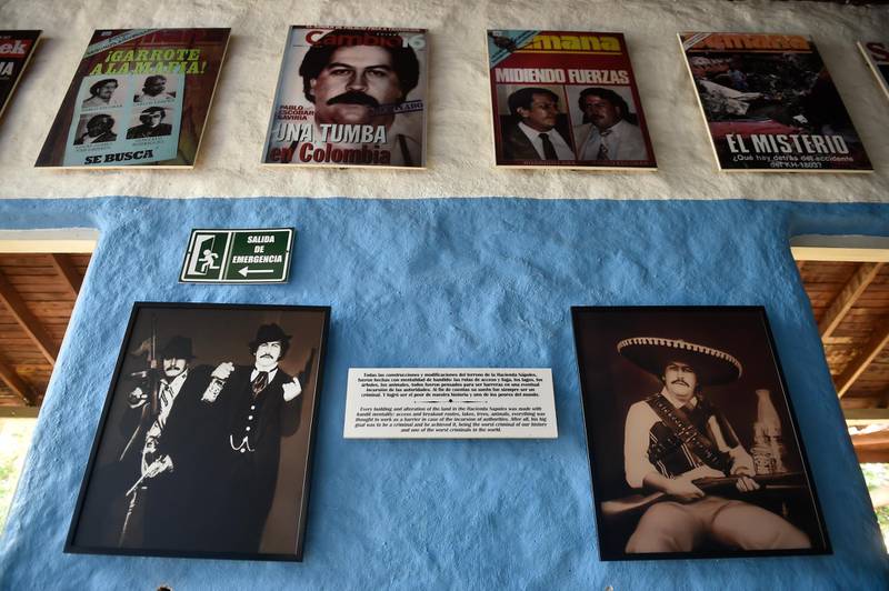 View of photographs of late drug kingpin Pablo Escobar at the Hacienda Napoles theme park, once the private zoo at his Napoles ranch, in Doradal, Antioquia department, Colombia on September 12, 2020. (Photo by Raul ARBOLEDA / AFP)