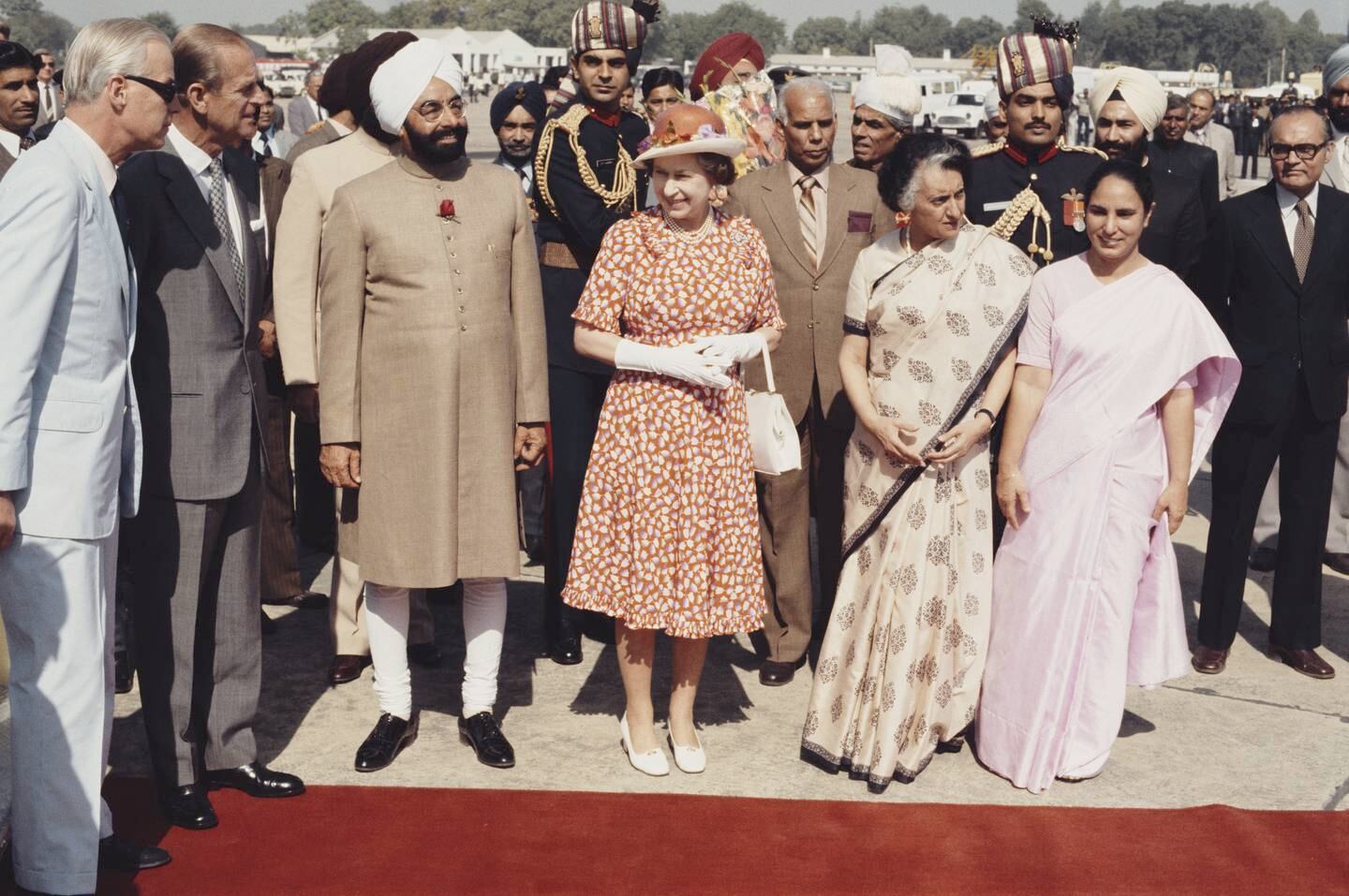 Queen Elizabeth II and Prince Philip are met by Indian Prime Minister Indira Gandhi and President Zail Singh at Palam Airport, New Delhi, during a Commonwealth tour of India, November 17, 1983.  Getty Images